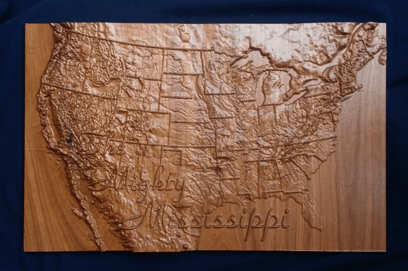 Picture of carved map of the United States showing the Mississippi River's extents
