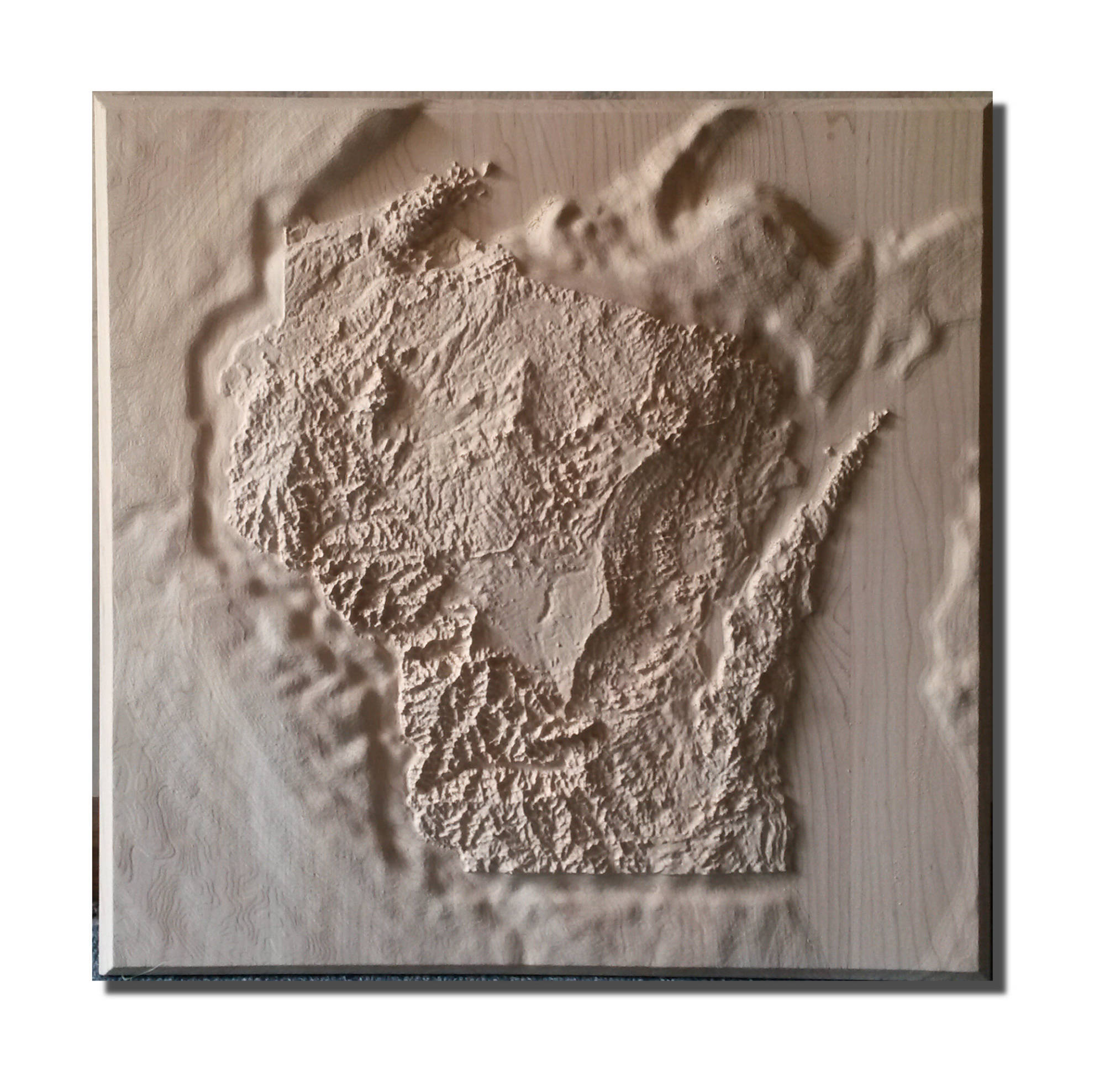 picture of a 30 inch square carved maple map of Wisconsin
